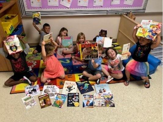 New teachers at Poinciana were offered Stuff the Bus funds to help create their classroom libraries. The VPK students are excited about their new books.